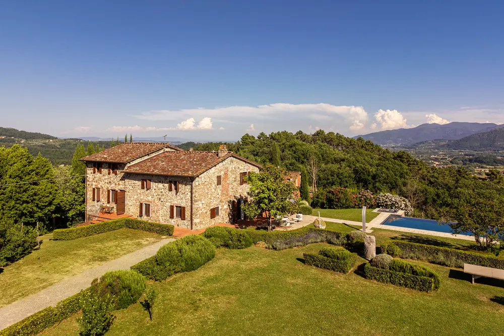 Aerial view of Triano among the hills and forest