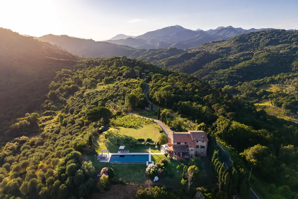 Aerial view of Triano casale at sunset with the Apuan Alps