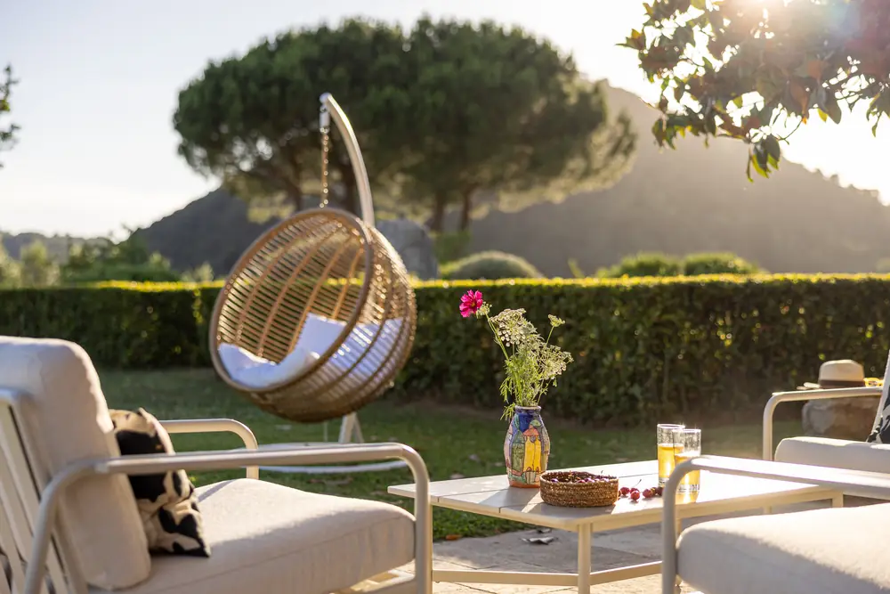 Outdoor seating and hanging chair at Triano
